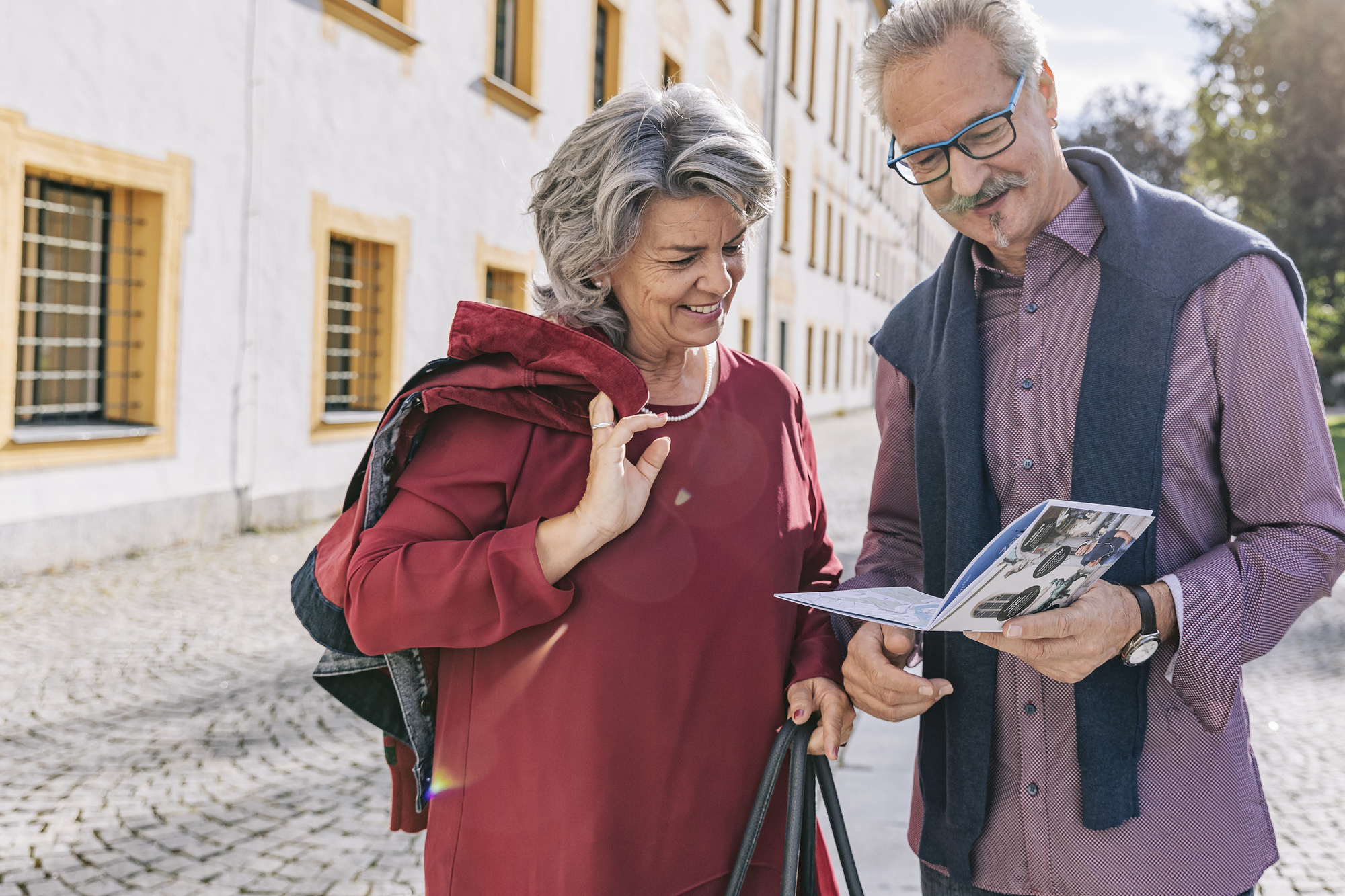 picture of a couple looking into a city map