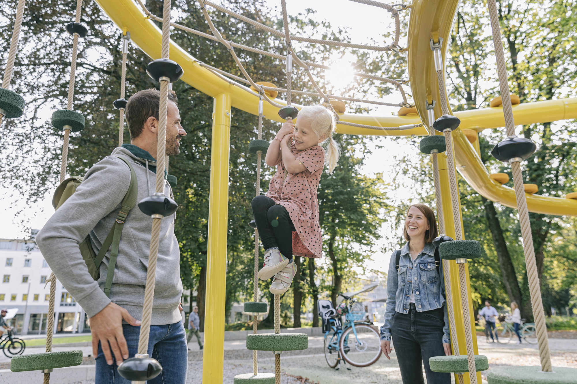 A family playing on the climbing frame