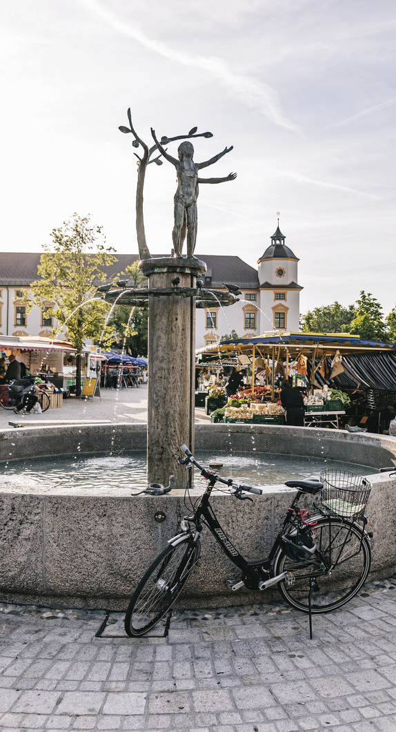 Kempten's weekly market in front of the Basilica of St. Lorenz