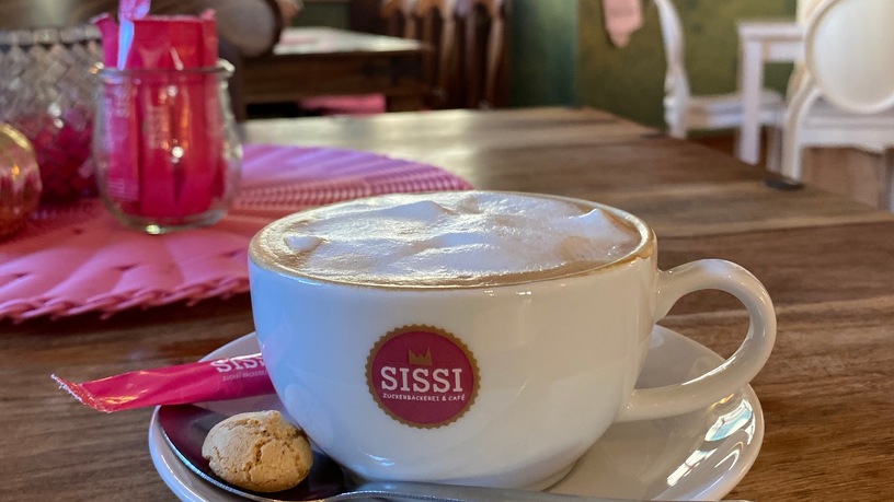 Cappucchino at pink Café Sissi on Town Hall Square