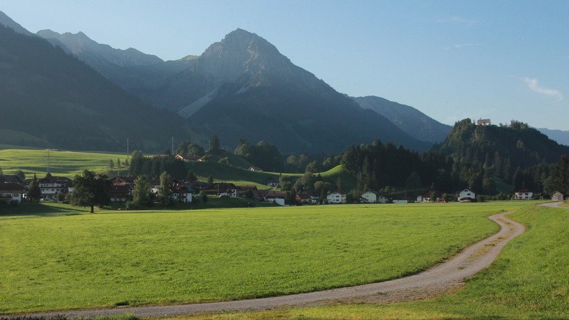 An idyllic village with a mountain in the background
