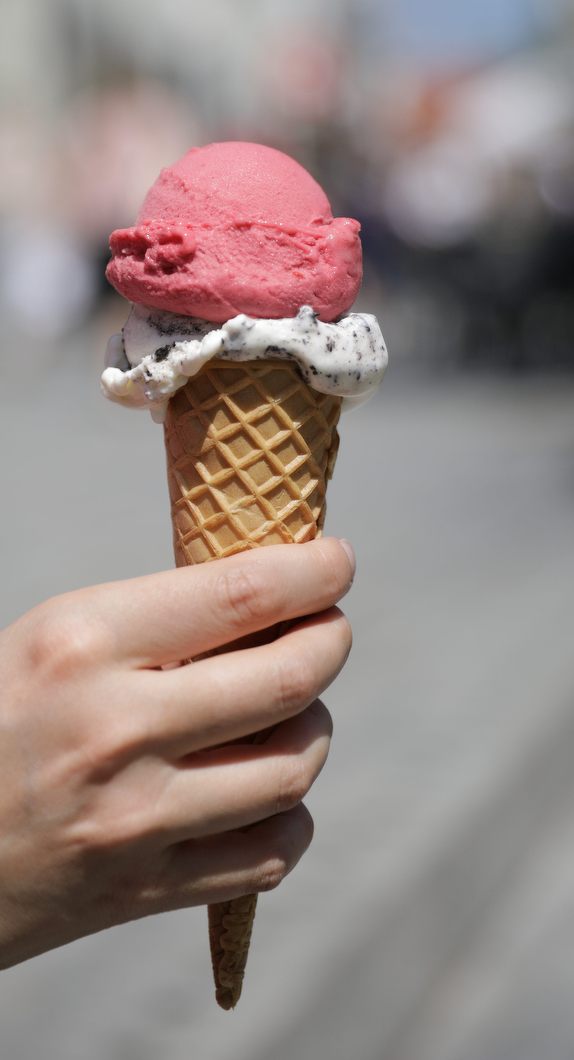 Two ice cream scoops in a cone