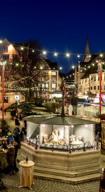 The beautiful Christmas market behind the fountain