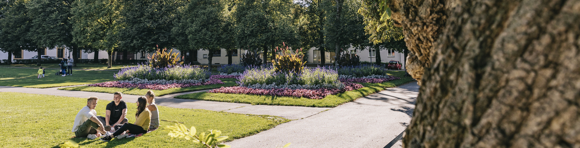 A group of four sitting in the courtyard garden