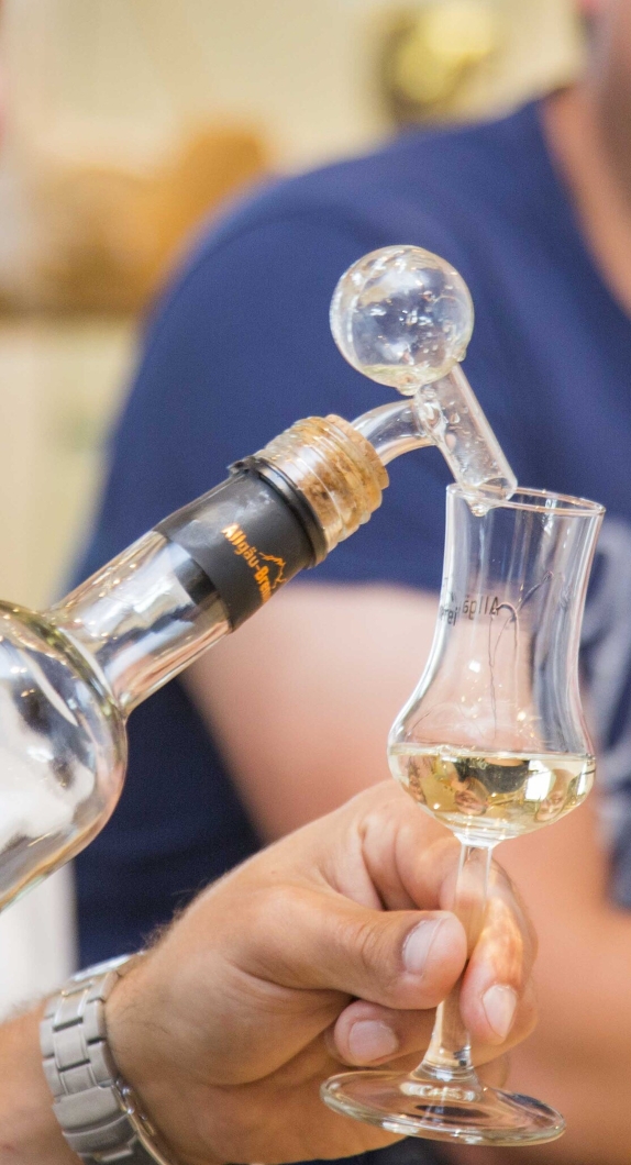 A shot glass is filled.