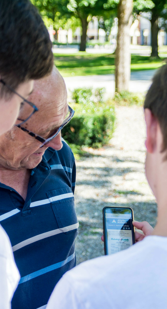 People looking together at a smartphone