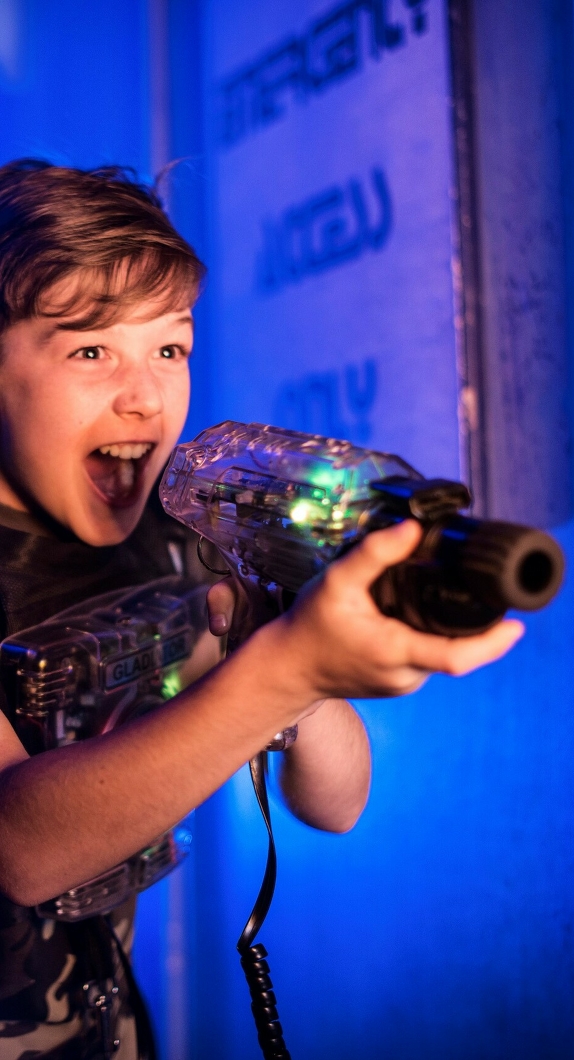 A boy playing laser tag